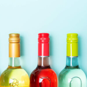Close-up photo of three bottles of wine to symbolise drug and alcohol awareness training for employees.