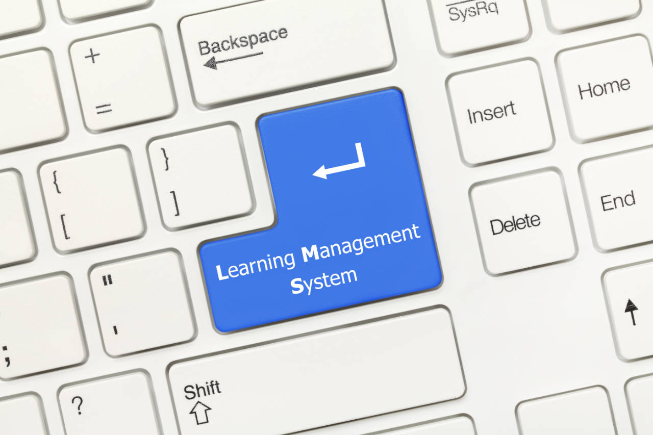 Close up view on white conceptual keyboard - Learning Management System