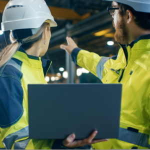 Two health and safety professionals carrying out a safety audit in a warehouse