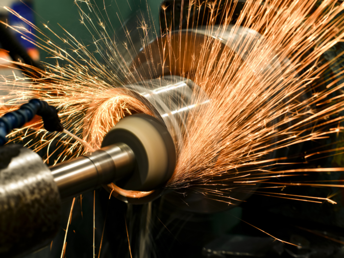 Abrasive wheel in use with sparks flying