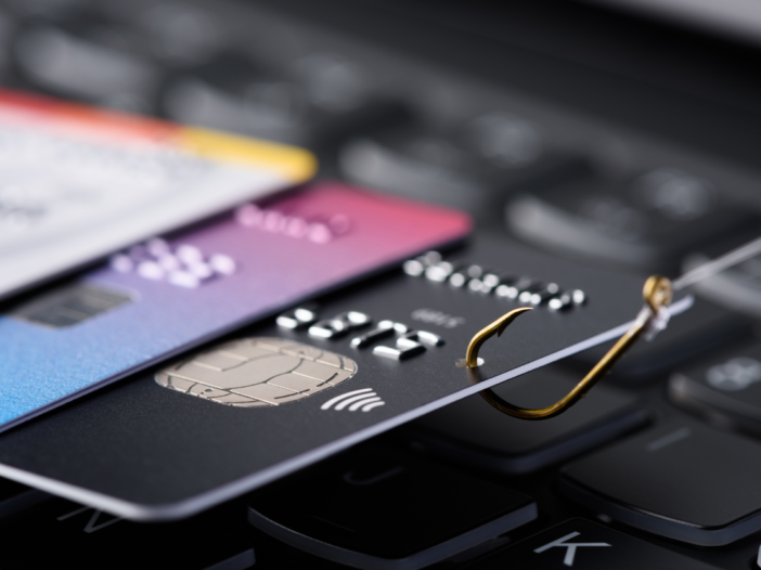 Credit cards on a computer to illustrate corporate fraud