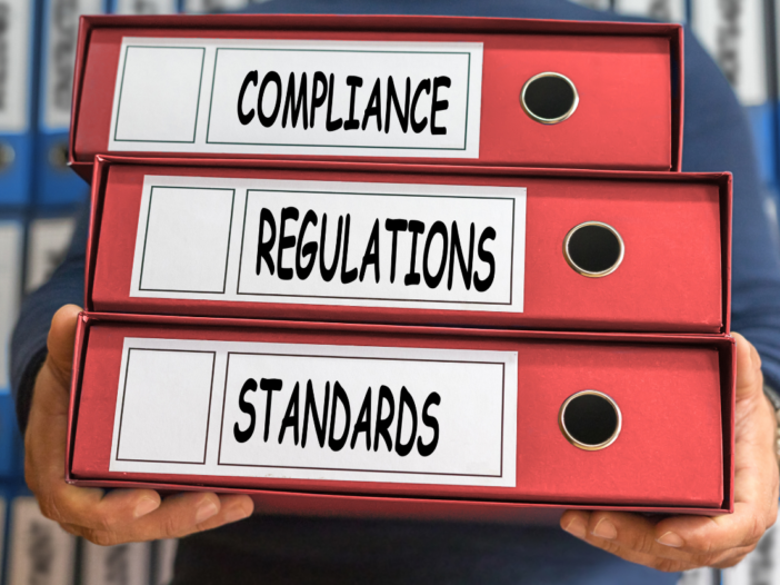 folders labelled compliance, regulations and standards to represent Safety Representatives and Safety Committees Regulations 1977