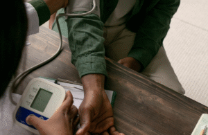 Man having blood pressure checked to illustrate health surveillance at work