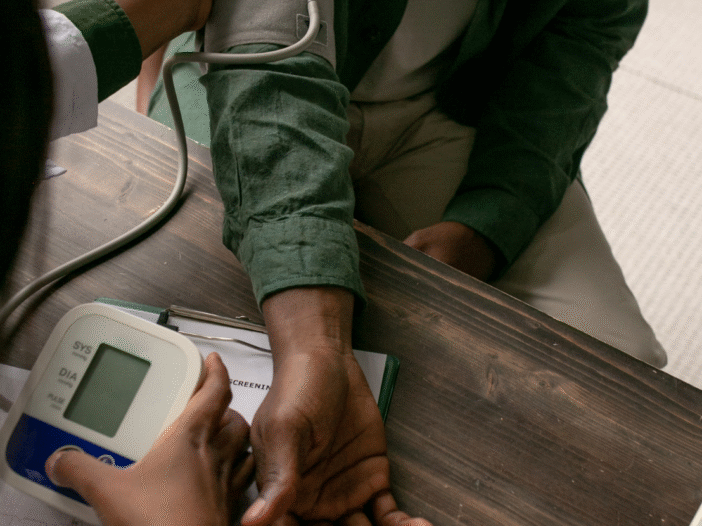 Man having blood pressure checked to illustrate health surveillance at work