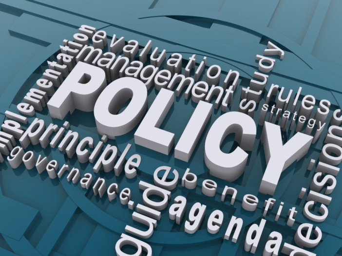 The word policy is shown in graphics with related words around it such as 'agenda', 'guide', 'principle'