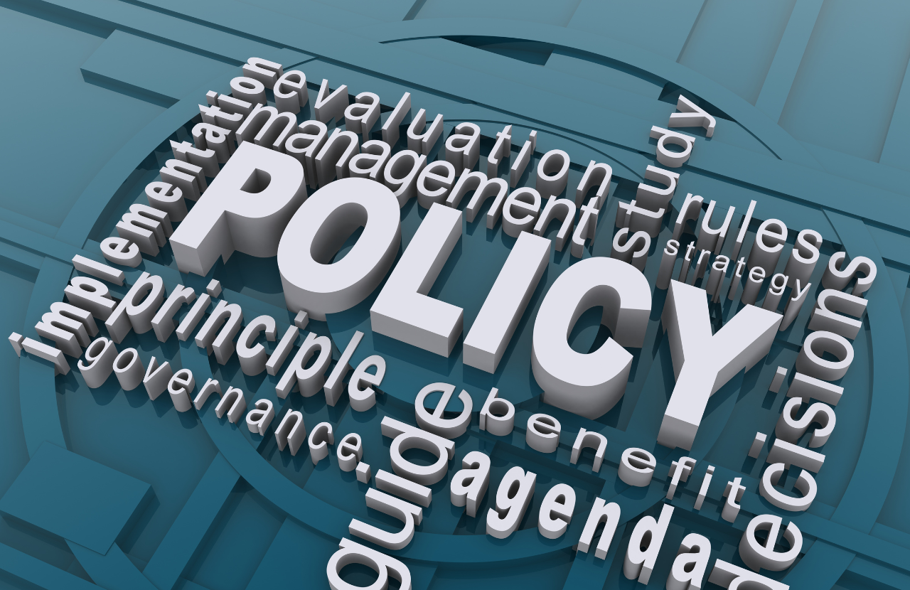The word policy is shown in graphics with related words around it such as 'agenda', 'guide', 'principle'