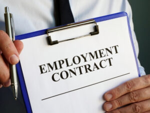 Employment Rights Act thumbnail - an office employee holding up an employment contract