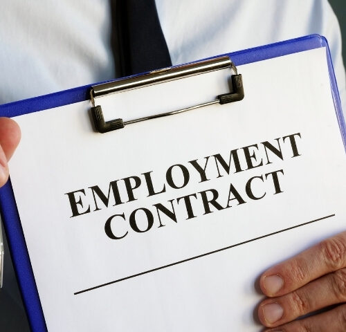 Employment Rights Act thumbnail - an office employee holding up an employment contract