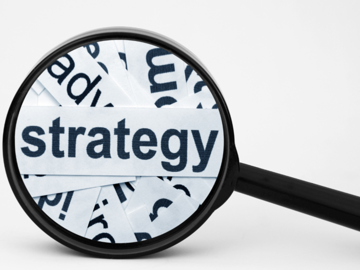 Magnifying glass with the word 'strategy' for fire strategy