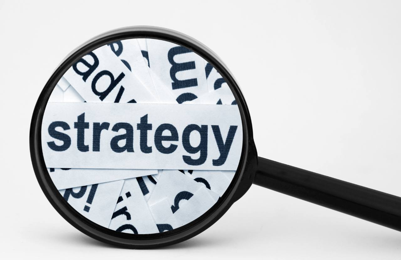 Magnifying glass with the word 'strategy' for fire strategy
