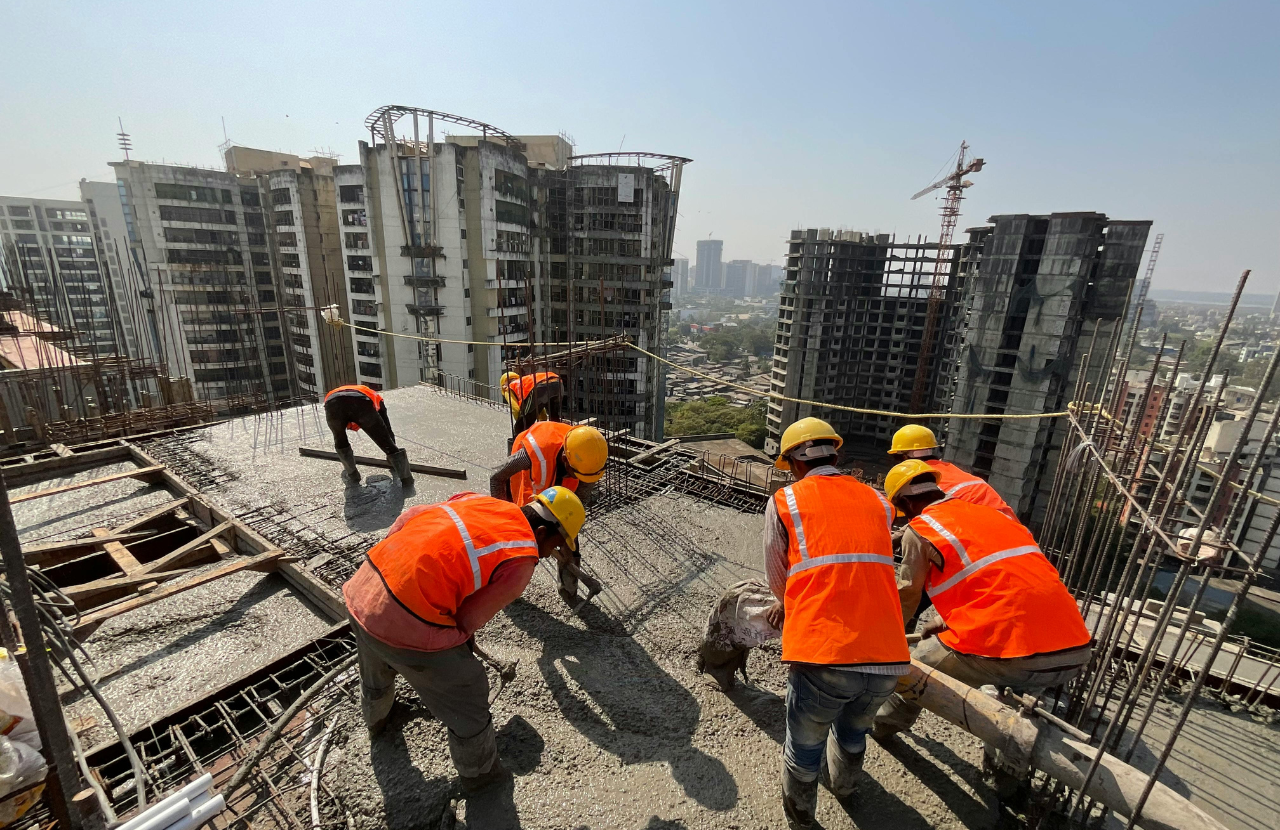 Workers on roof in full PPE to show importance of permit to work system