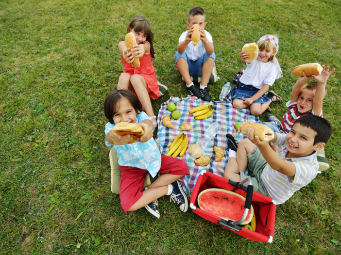 Group of children on a school picnic to illustrate allergy training for schools - Benedict's Law
