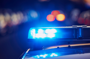 Police car siren close up out of focus at night to illustrate Crime and Policing Act.