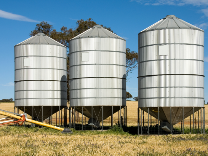 Three grain silos to illustrate definition of a confined space