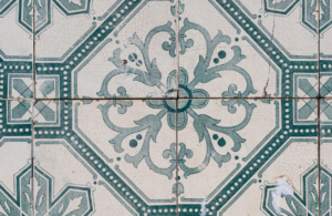 Asbestos kitchen tiles slightly cracked with a symmetrical, pale green pattern to illustrate non licensed work with asbestos
