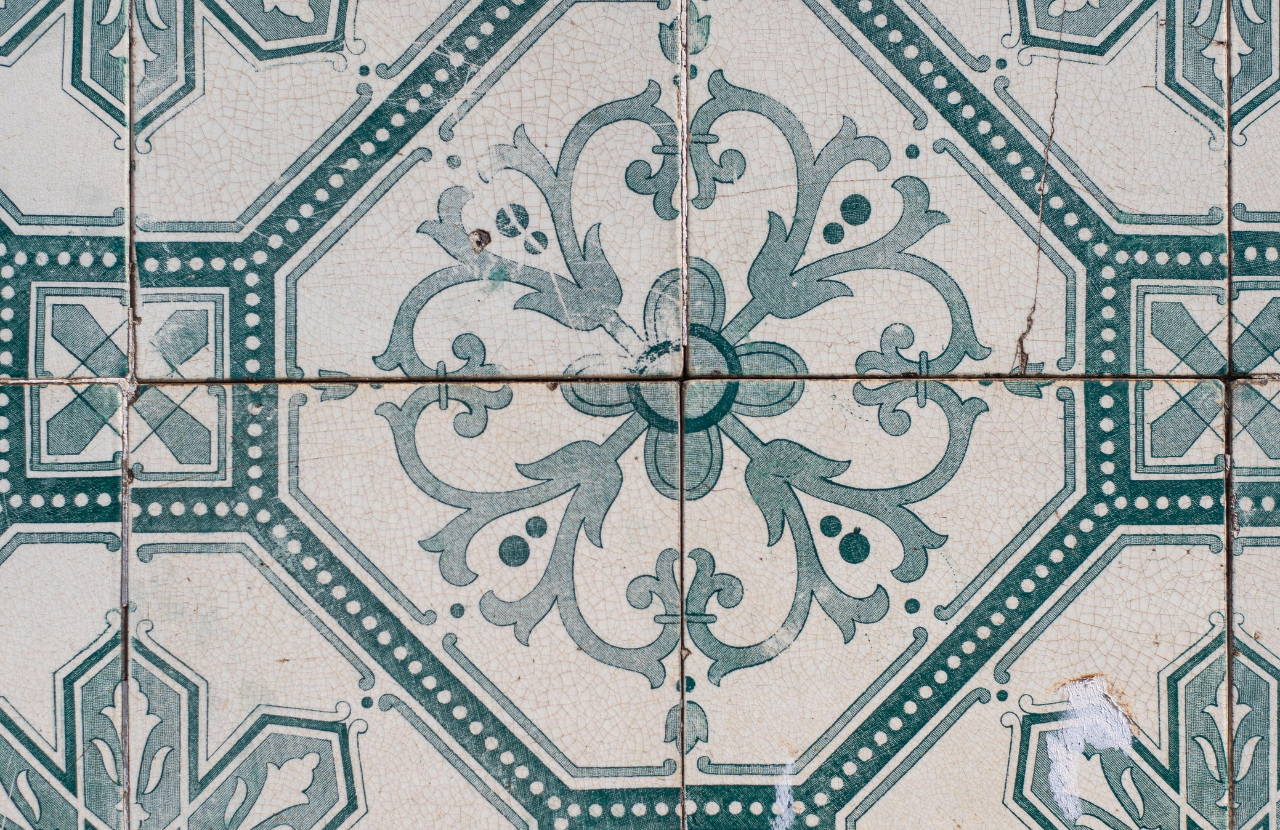 Asbestos kitchen tiles slightly cracked with a symmetrical, pale green pattern to illustrate non licensed work with asbestos