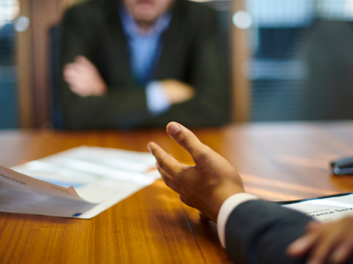 Employee being confronted about employee fraud.