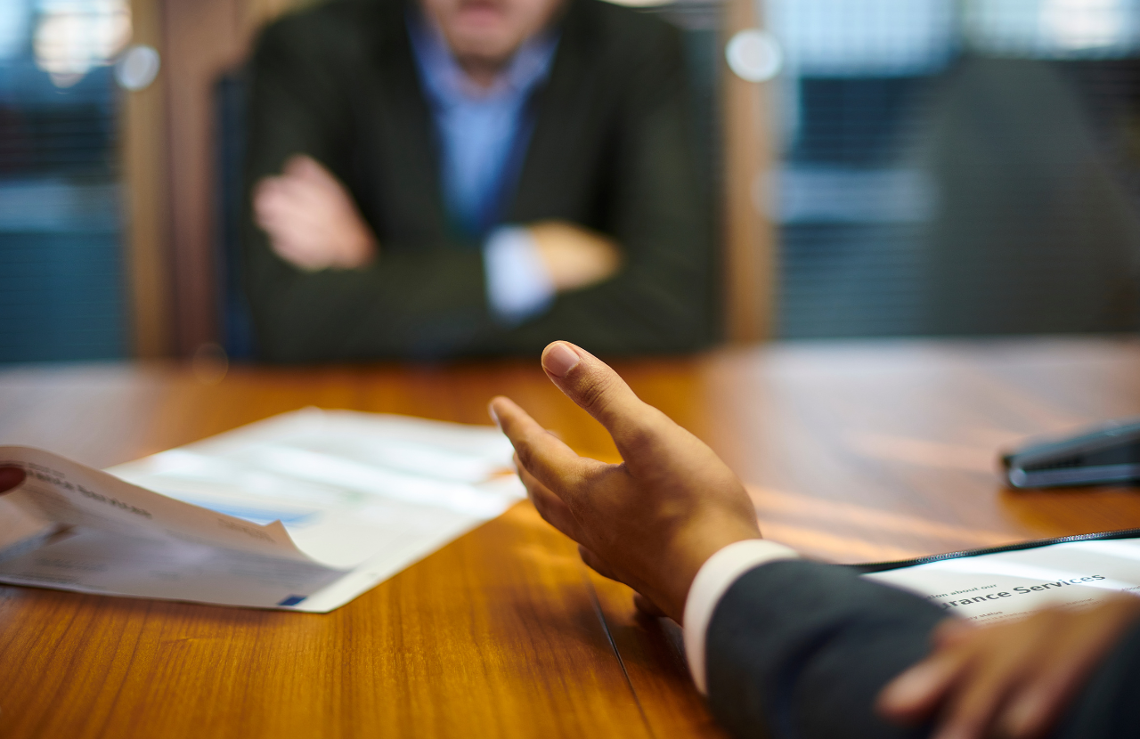 Employee being confronted about employee fraud.
