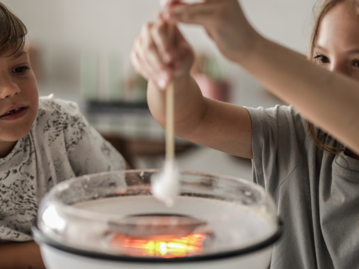 Two children cooking to illustrate health and safety in schools allergies.