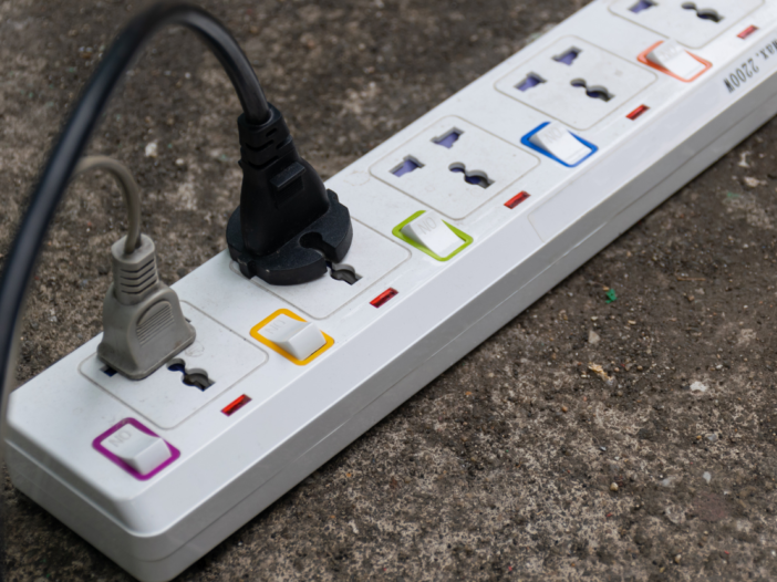 Extension lead outside with two leads plugged in to symbolise electrical training for non electricians